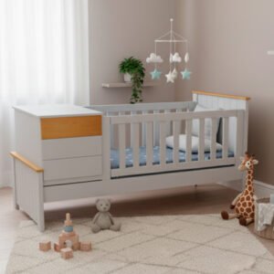 Cuna funcional modelo Esperanza en color blanco con detalles en madera natural, cajonera integrada y barandas de seguridad sobre fondo blanco.