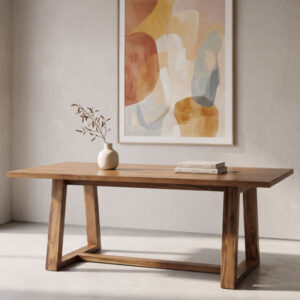 Primer plano detallado de la superficie de una mesa Modena, con un enchapado de madera de peteribí de tono marrón cálido que exhibe una veta fina y uniforme, mostrando los bordes limpios y modernos de la mesa con un enfoque suavizado en el fondo.